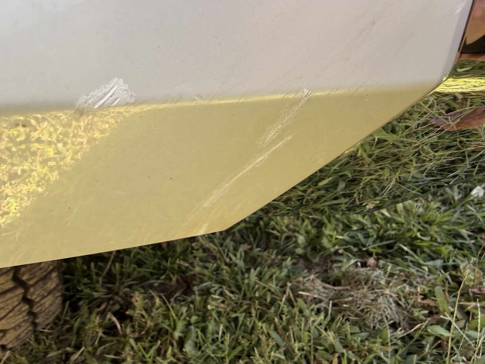 Scrapes along the lower edge of the front bumper