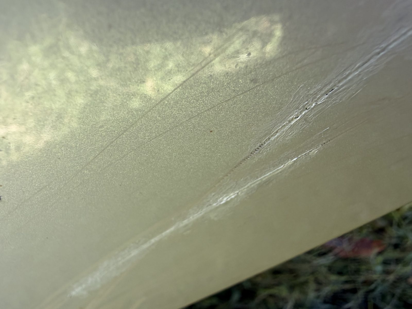 Gouges in the lower valance below the bumper