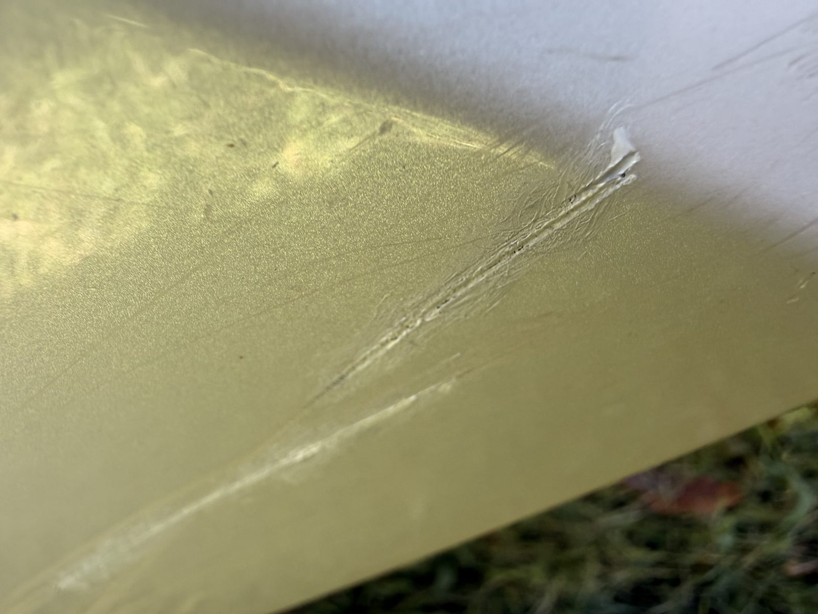 Second close-up of gouges in the lower valance